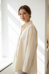 Oversized cotton shirt in Soft Vanilla Cream, three-quarter turn pose
