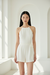 Luxury backless halter romper in Ivory White – front view