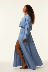 Women's flowy maxi skirt set in powder blue, side profile pose